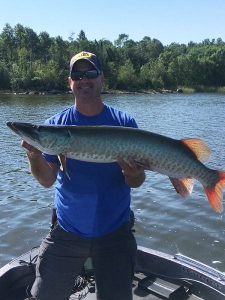 Ontario Wilderness Houseboat Man With Muskie