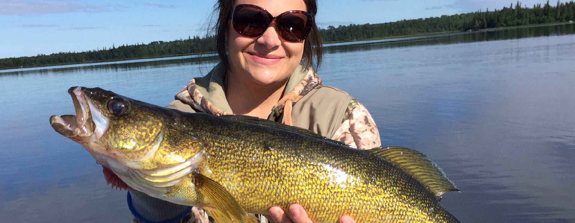 Happy Vacationer Holding Walleye